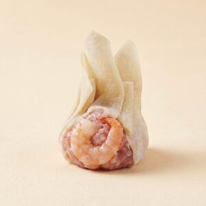 Close-up shot of steaming hot authentic Cantonese shrimp and pork wonton showing translucent wrapper and whole shrimp filling