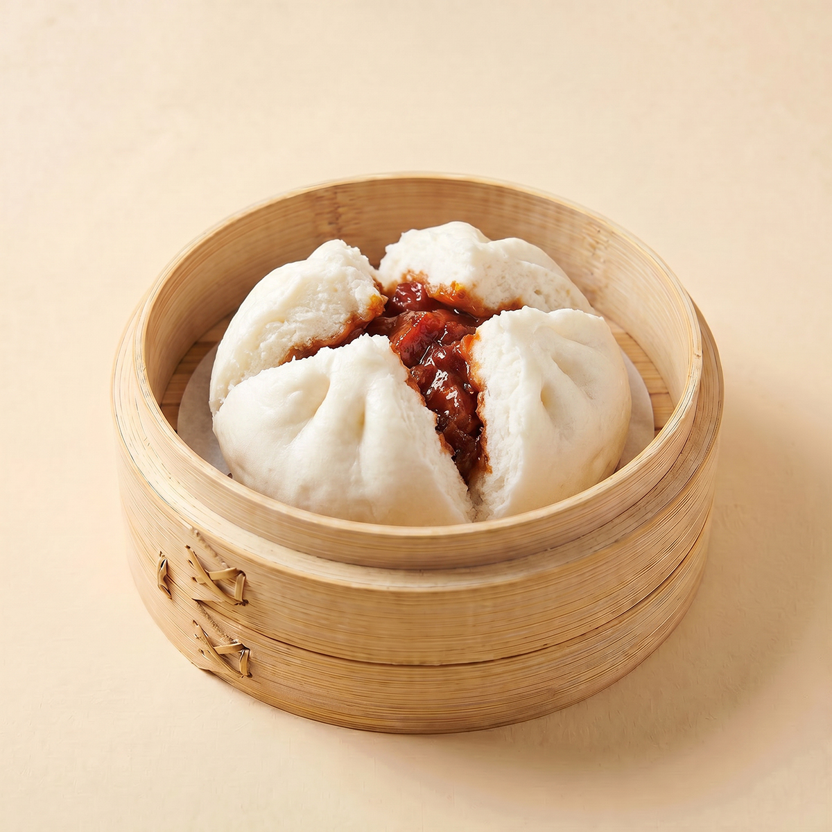 Close-up shot of a steaming hot large 130g traditional BBQ pork bun char siu bao split open
